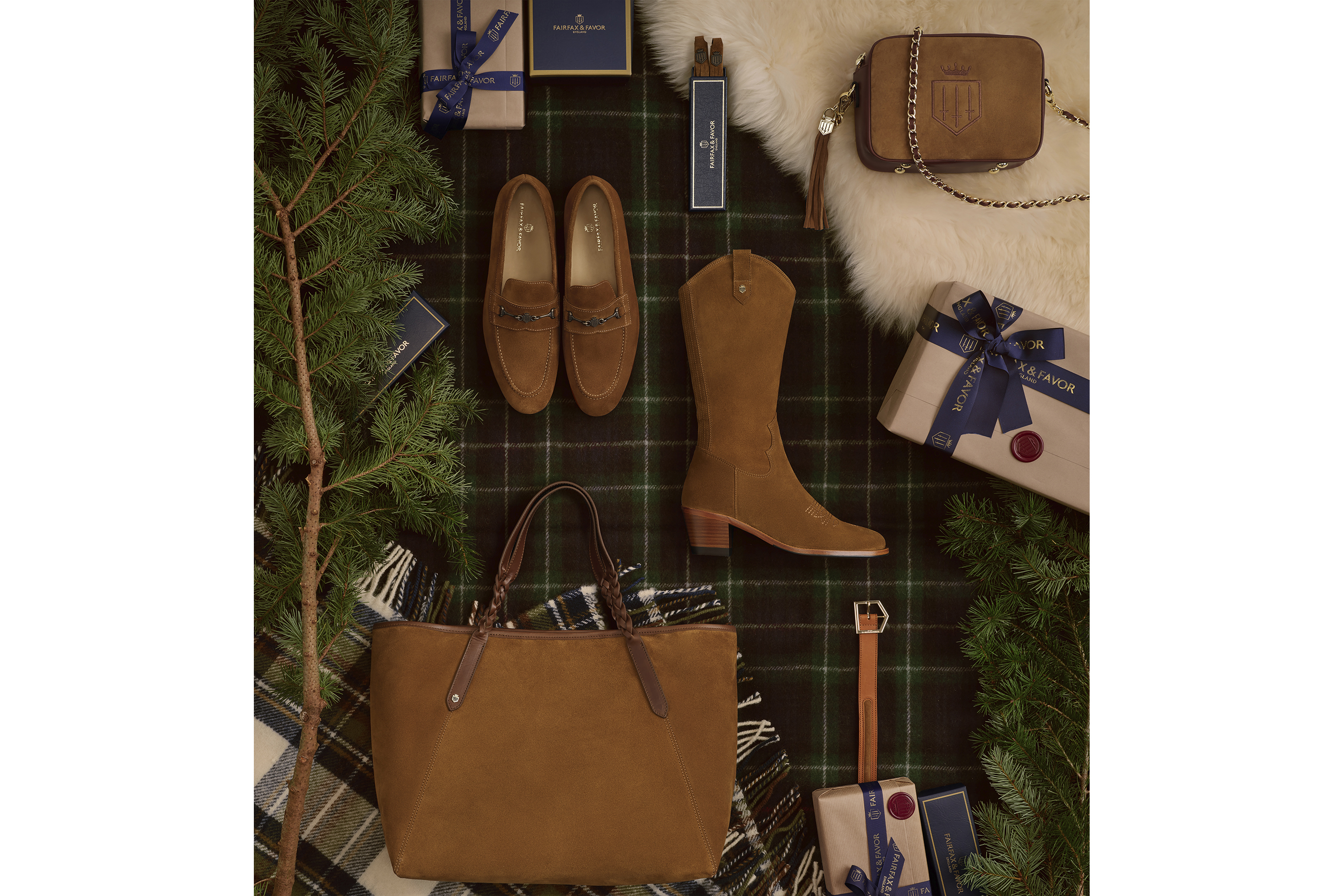 Flat lay photo shoot with shoes handbags and Christmas Presents laying down on a rug